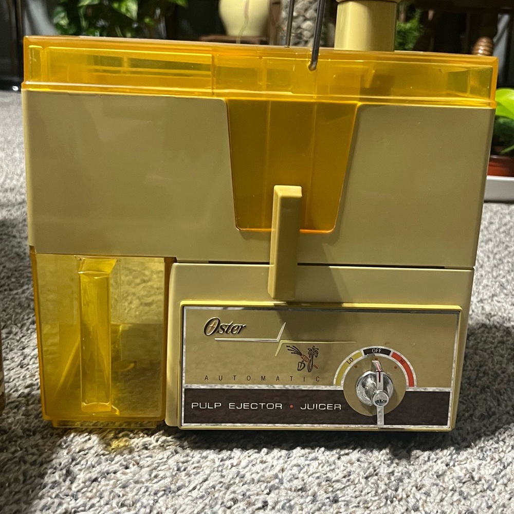 Oster Yellow Pulp Ejector Juicer with Translucent Accents